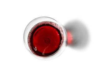 Glass with red wine on white background