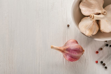 Fresh garlic on light background, top view