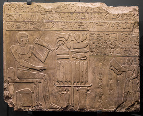 ancient stone relief at Chnum temple in Egypt