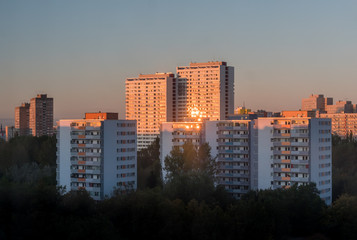 Fototapeta na wymiar Ugly Berlin apartment blocks during sunrise