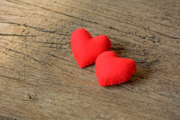 Fototapeta na wymiar Two red heart on old wood background