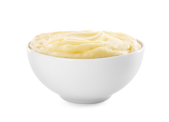 Bowl with mashed potatoes on white background