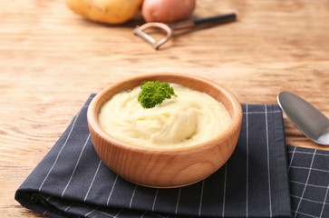 Bowl with mashed potatoes on table