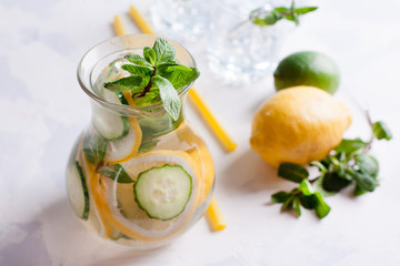 detox cocktails with cucumber and lemon on a light background, option for filing, decorating