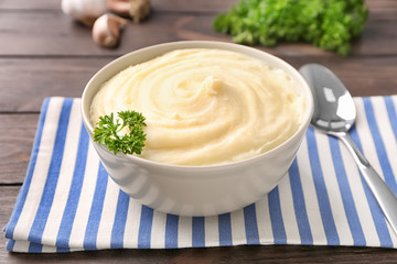 Bowl with mashed potatoes on table