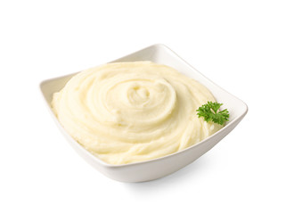 Dish with mashed potatoes on white background
