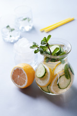 detox cocktails with cucumber and lemon on a light background, healthy lifestyle, fitness drinks