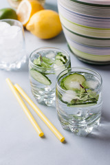 detox cocktails with cucumber and lemon on a light background, healthy lifestyle, fitness drinks, spring avitaminosis, cold prevention