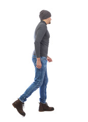 Back view of going  handsome man. walking young guy .