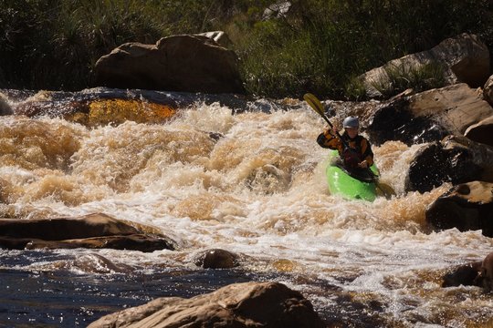 Woman kayaking in river