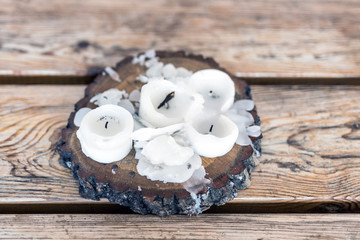 Burnt candles with melted wax on a wooden table