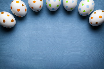 White Easter eggs on blue background