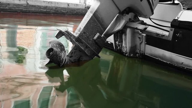 Old boat with engine and reflection in water Venice
Still image with moving water. Loop. Cinemagraph