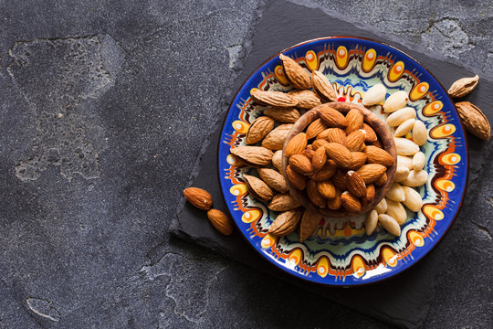 Three kind of almond: in shell, natural and peeled nut. Healthy food concept top view