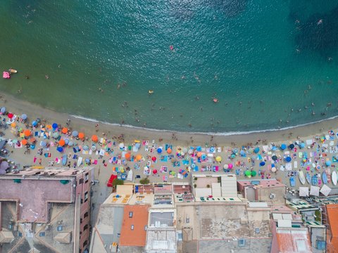 Beach Umbrellas And Building Along The Sea Coast