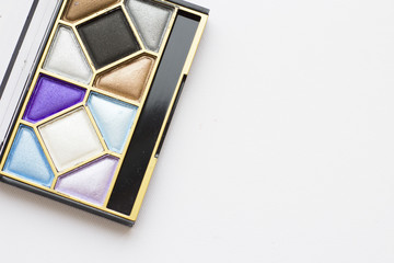 Make Up Beauty Fashion Concept. Daily and evening shimmer eye shadow palette on white, top view
