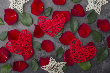 Hearts and stars in the leaves of a rose on a dark background. Valentine's day or wedding. Wedding