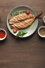 White fish juicy fillet grilled on barbecue