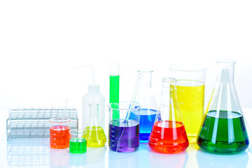 Laboratory glassware with colorful chemical reagent in research laboratory 
