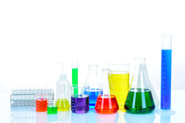 Laboratory glassware with colorful chemical reagent in research laboratory 
