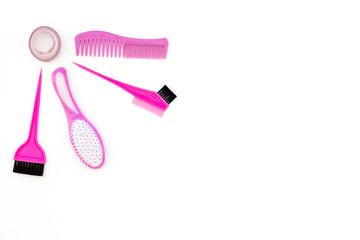 Professional hairdressing tools in beauty saloon. Combs, brushes on white background top view copy space