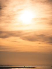silhouette of couple on the beach at sunset