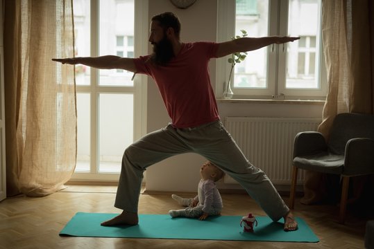Man performing yoga on exercise mat