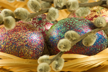 image of pussy-willow and easter eggs on a table closeup