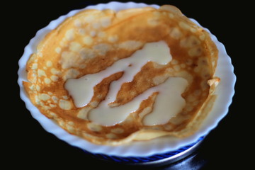 Pancakes with condensed milk  . Thin and round. Russian food. Carnival day. Shrovetide, pancake week.