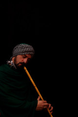 Muslim man with turban playing ney - Traditional sufi music © Smailhodzic
