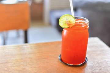Lemon Iced Tea in Glass Jar on Wooden Table