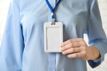 Woman with blank badge, closeup. Mockup for design
