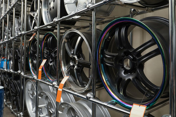 Fototapeta na wymiar Rack with car wheels in automobile store