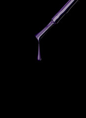 purple nail polish brush on black background.jpg