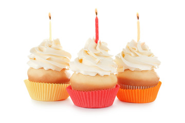 Birthday cupcakes with candles on white background