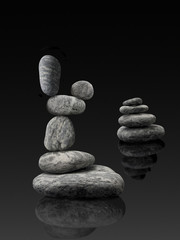 equilibrium stone towers on black background