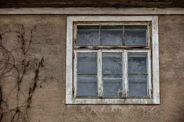 Old retro window of abandoned buildings