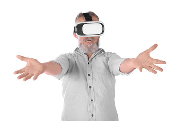 Senior man with virtual reality headset on white background