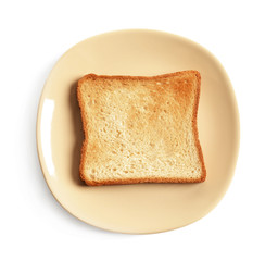 Plate with toasted bread on white background