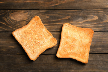 Toasted bread on wooden background