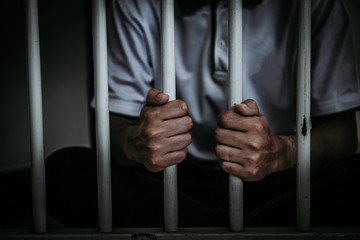 Hands of men desperate to catch the iron prison,prisoner concept,thailand people,Hope to be free.