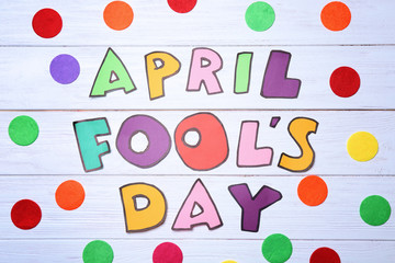 Phrase "April fool's day" on wooden background