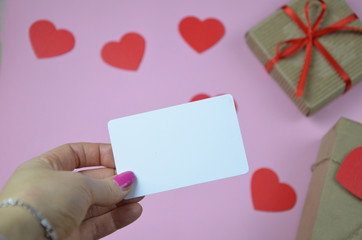 Obraz premium blank Valentines day greeting or gift card and gift box, heart. Top view with copy space