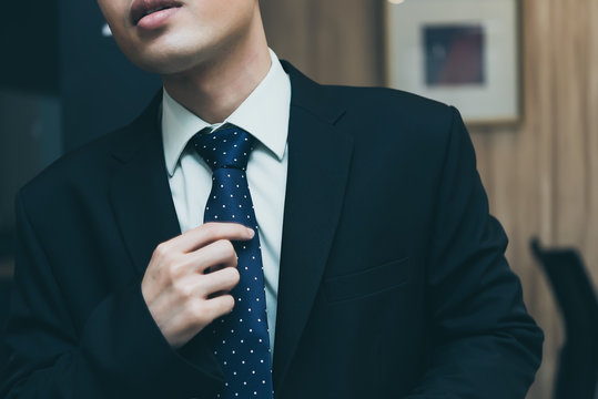 Handsome asian man in black suit,Thailand people - Powered by Adobe