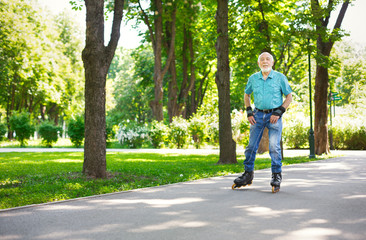 Senior man roller skating outdoors