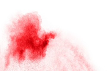 abstract red dust splattered on  white background. Red powder explosion on white background. Freeze motion of red particles splash.