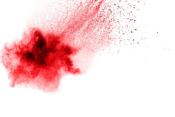 abstract red dust splattered on  white background. Red powder explosion on white background. Freeze motion of red particles splash.
