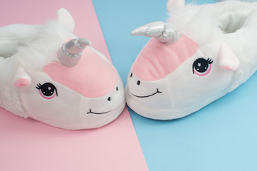 pop art pair of fluffy unicorn slippers