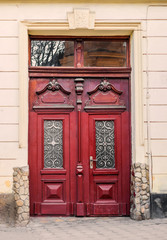 Ancient door in an old house. Red color.