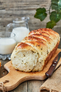 Bread with provence herbs and a jug of milk for breakfast